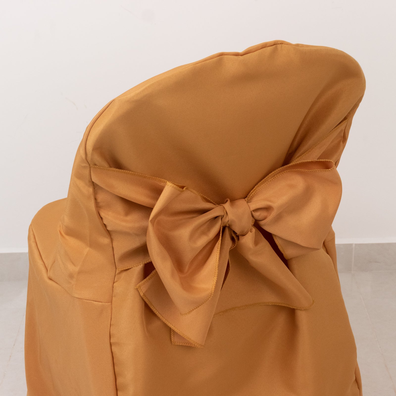10-Pack Polyester Slip-On Folding Chair Covers with Attached Sashes – Gold Durable Reusable Covers for Wedding & Event Decor