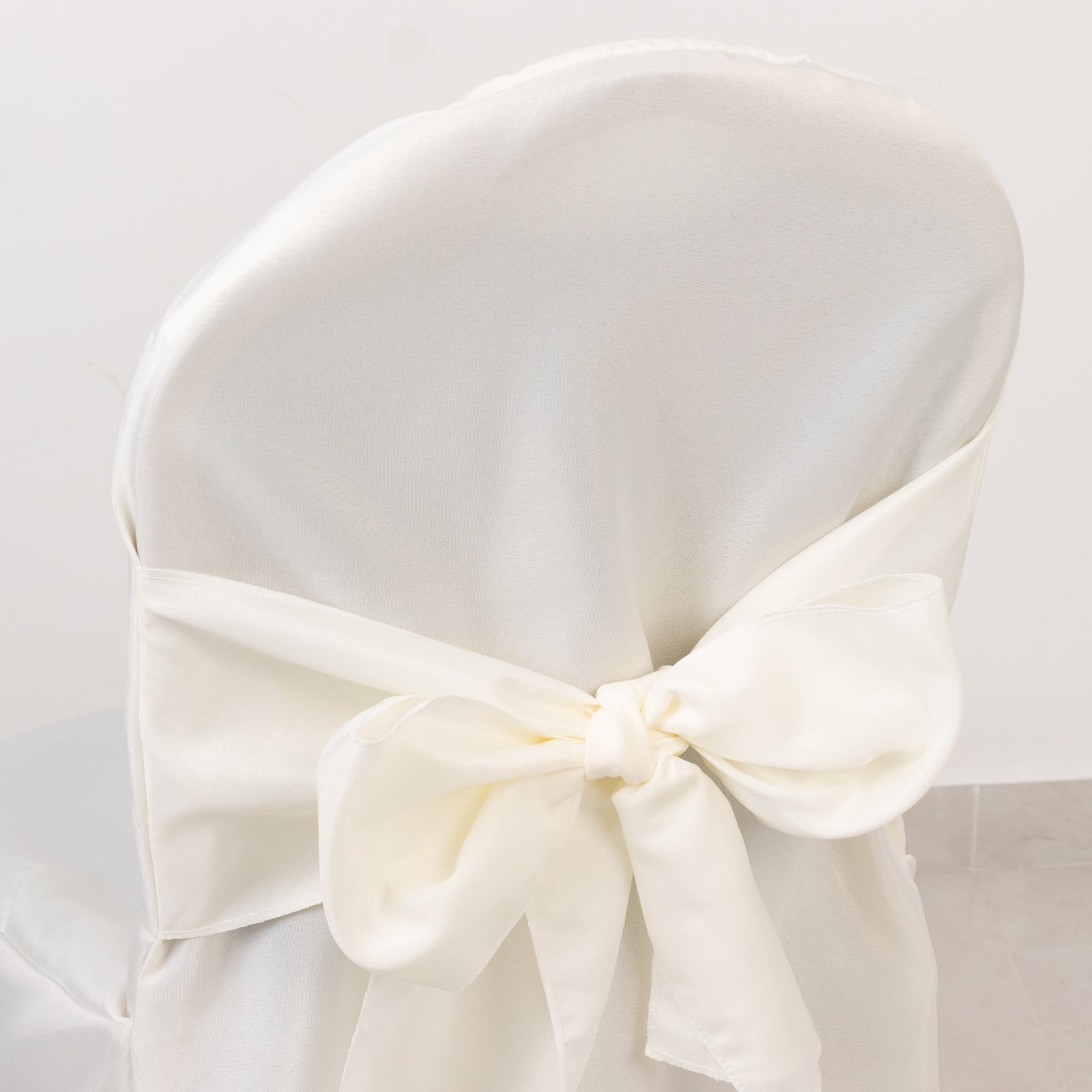 10-Pack Polyester Slip-On Banquet Chair Covers with Attached Sashes – Ivory Reusable Stain-Resistant Covers for Wedding & Event Decor