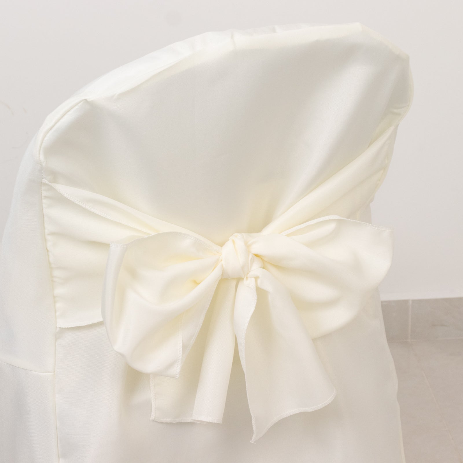 10-Pack Polyester Slip-On Folding Chair Covers with Attached Sashes – Ivory Durable Reusable Covers for Wedding & Event Decor
